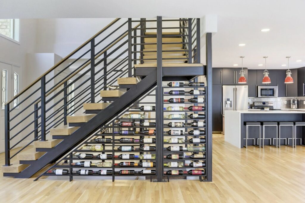 A Staircase With Wine Bottles Displayed on the Wall